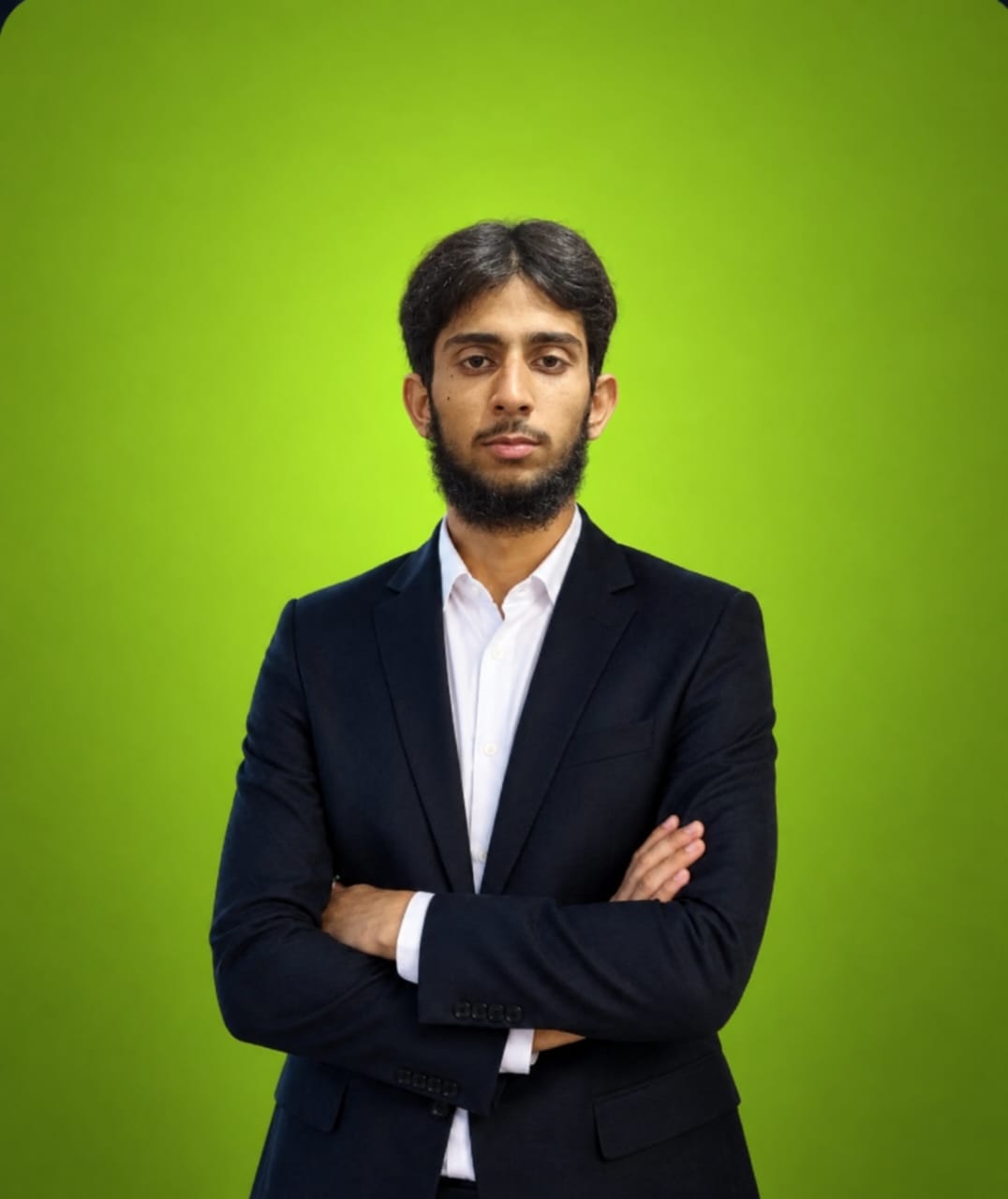 Muhammad Daoud Ali in a dark suit with arms crossed